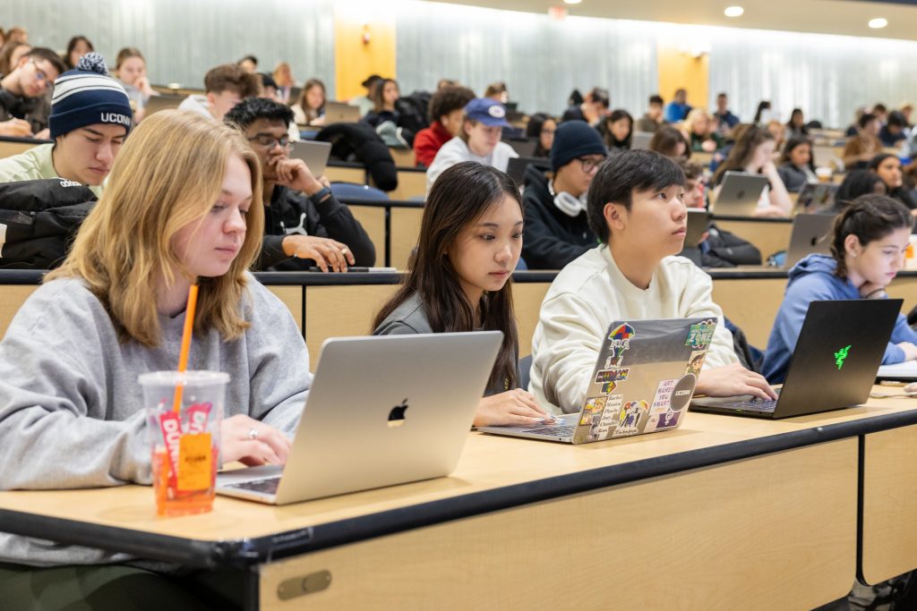 UConn students sit in class